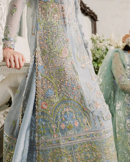 Shop this ice blue chiffon suit with pearl & sequin work, sequinned net dupatta, foil silk trouser & handcrafted tassels. Perfect for festive & formal occasions!