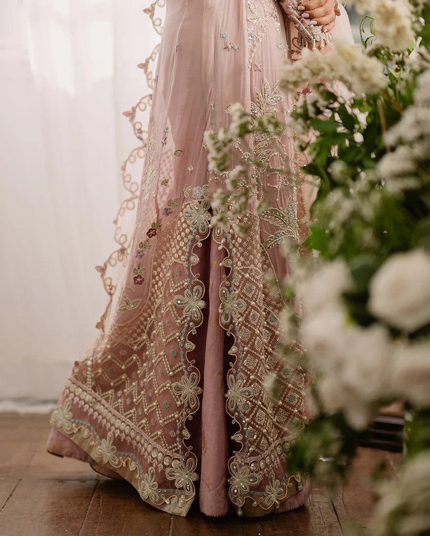 Luxurious chiffon suit with pearl & sequin work, foil printed silk trouser, and 3D floral organza dupatta. Includes tassels, zari & handcrafted finishes.