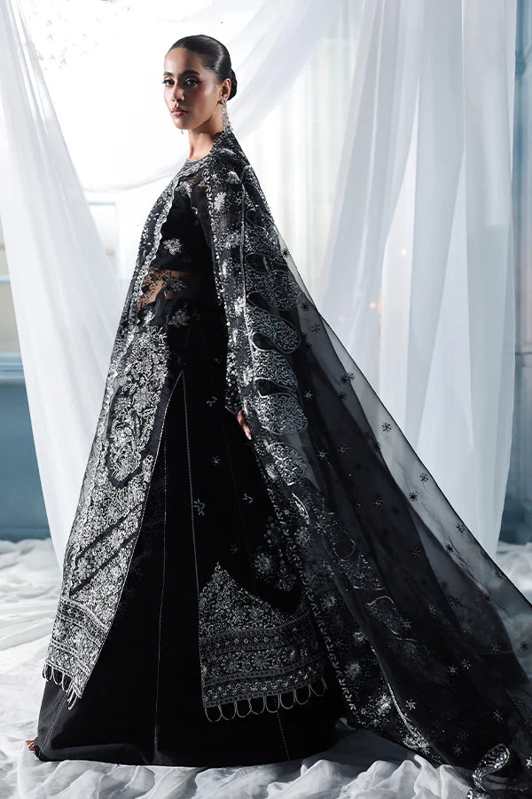 Black organza unstitched suit with celestial embroidery, raw silk shahrara and heavily embellished dupatta pallus for luxurious evening wear occasions.