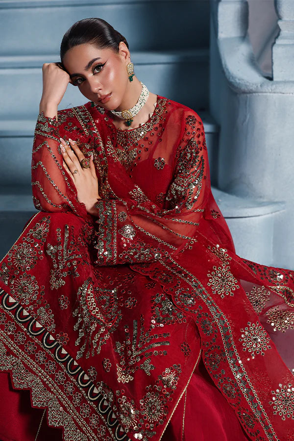 Scarlet red organza unstitched suit with artisanal embroidery, raw silk shahrara and lavishly embellished dupatta pallus for regal festive wear.
