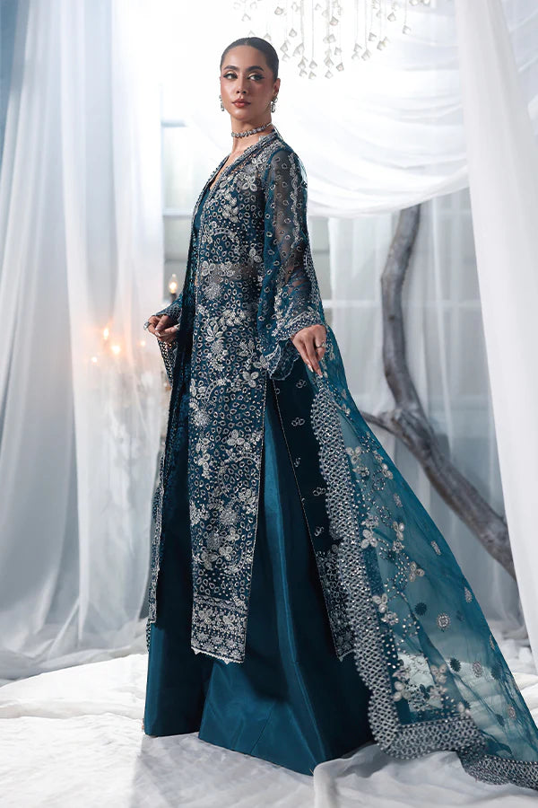 Deep teal organza unstitched suit with silver embroidery, raw silk shahrara and embroidered dupatta, designed for women who love timeless elegance wear.