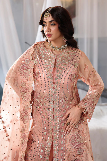 Peach organza unstitched suit with fine embroidery, raw silk shahrara and artistic dupatta, designed for elegant festive and evening wear occasions.