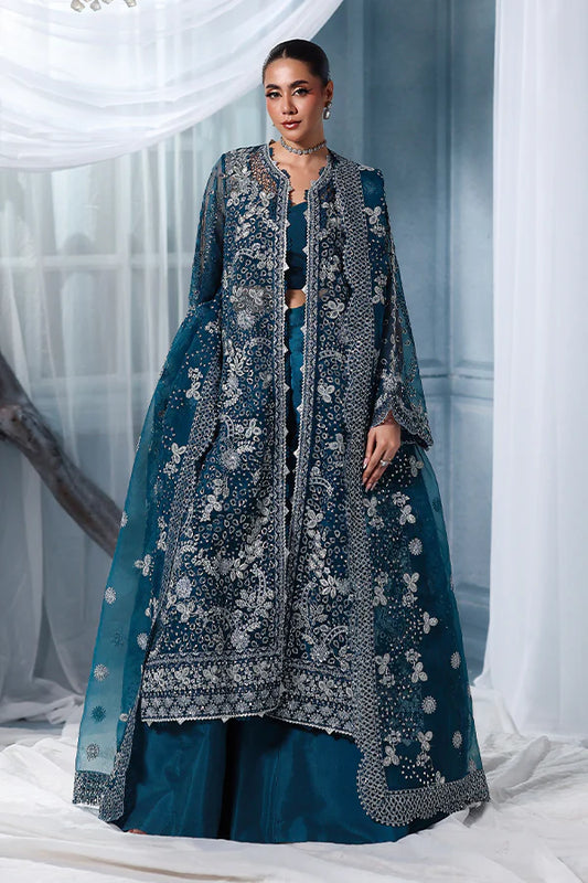Deep teal organza unstitched suit with silver embroidery, raw silk shahrara and embroidered dupatta, designed for women who love timeless elegance wear.