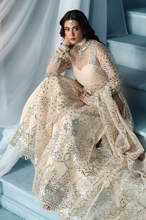Warm ivory organza unstitched suit with silver embroidery, raw silk shahrara and luxuriously embellished dupatta pallus for festive luxury wear occasions.