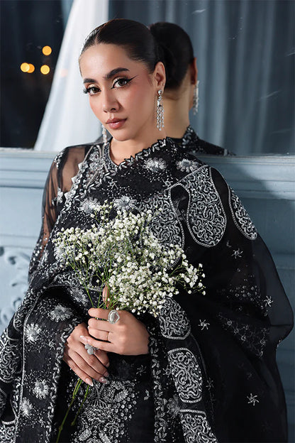 Black organza unstitched suit with celestial embroidery, raw silk shahrara and heavily embellished dupatta pallus for luxurious evening wear occasions.