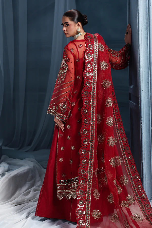 Scarlet red organza unstitched suit with artisanal embroidery, raw silk shahrara and lavishly embellished dupatta pallus for regal festive wear.