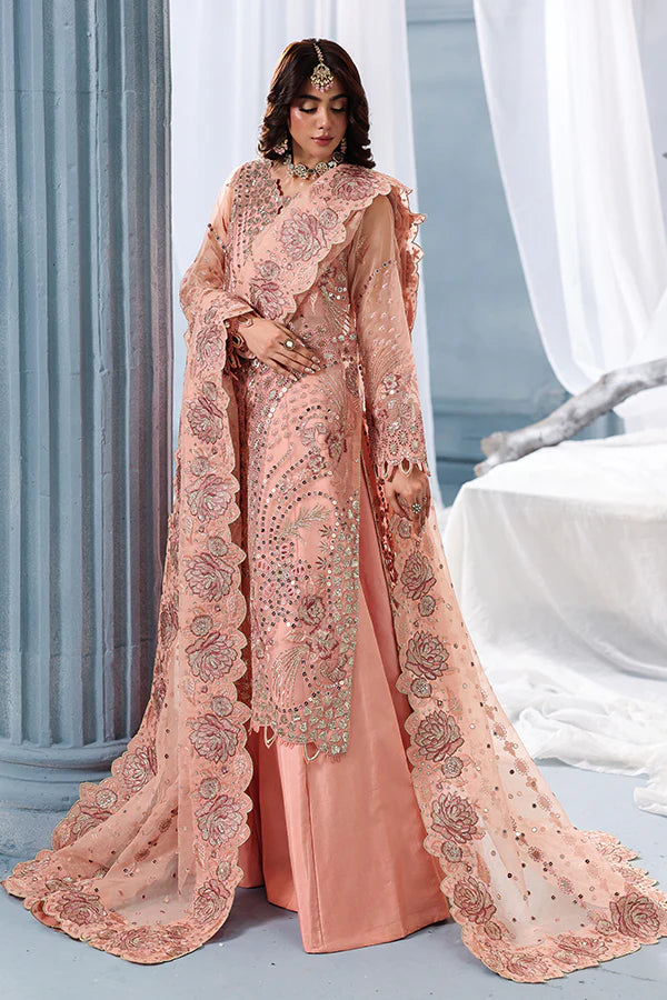 Peach organza unstitched suit with fine embroidery, raw silk shahrara and artistic dupatta, designed for elegant festive and evening wear occasions.