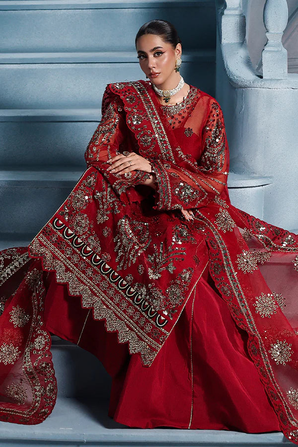 Scarlet red organza unstitched suit with artisanal embroidery, raw silk shahrara and lavishly embellished dupatta pallus for regal festive wear.