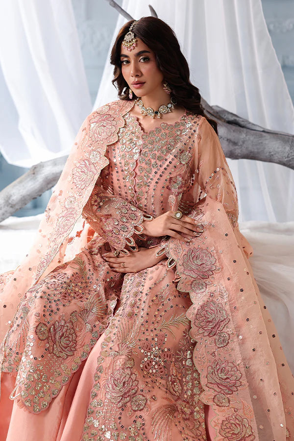 Peach organza unstitched suit with fine embroidery, raw silk shahrara and artistic dupatta, designed for elegant festive and evening wear occasions.