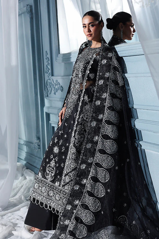 Black organza unstitched suit with celestial embroidery, raw silk shahrara and heavily embellished dupatta pallus for luxurious evening wear occasions.