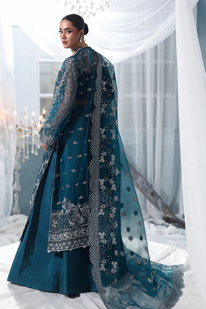 Deep teal organza unstitched suit with silver embroidery, raw silk shahrara and embroidered dupatta, designed for women who love timeless elegance wear.