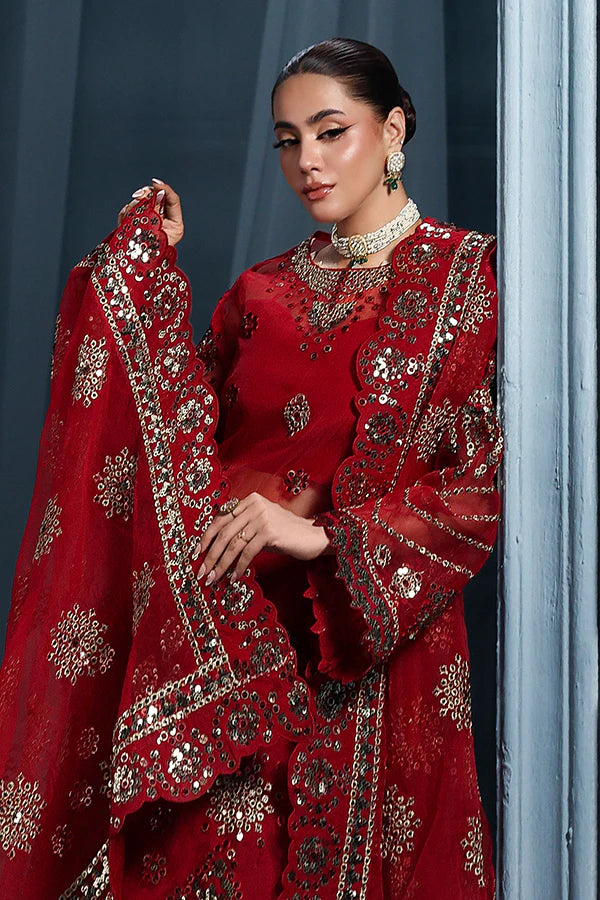 Scarlet red organza unstitched suit with artisanal embroidery, raw silk shahrara and lavishly embellished dupatta pallus for regal festive wear.