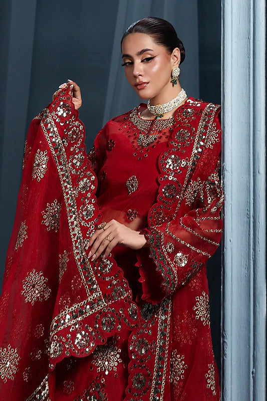 Scarlet red organza unstitched suit with artisanal embroidery, raw silk shahrara and lavishly embellished dupatta pallus for regal festive wear.