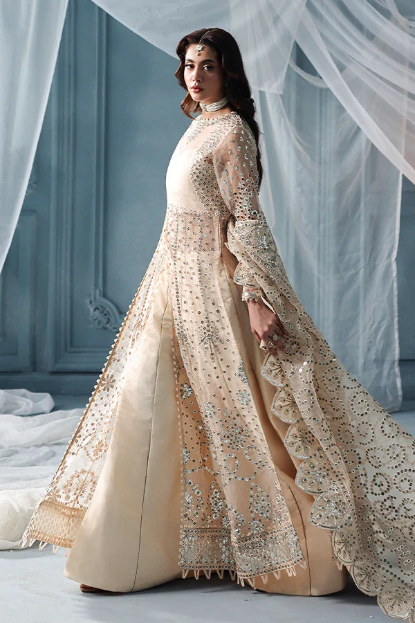 Warm ivory organza unstitched suit with silver embroidery, raw silk shahrara and luxuriously embellished dupatta pallus for festive luxury wear occasions.