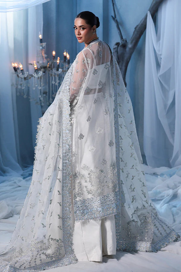 Off-white ivory organza unstitched suit with fine threadwork, contrast silk borders, raw silk shahrara and embellished dupatta for elegant festive wear.