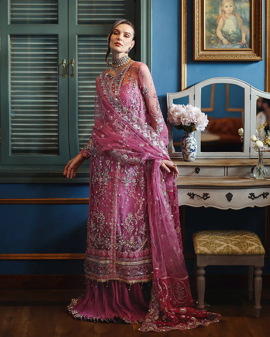 Elegant hand-embellished net shirt with sequins, pearls & organza, paired with dyed silk lehenga. Perfect for festive & bridal occasions.