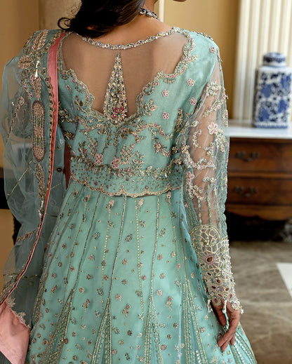 Luxury wedding formal featuring hand-embroidered sequined net shirt, raw silk lehenga, sequined dupatta, and exquisite mirror, golden, and organza lace finishes.