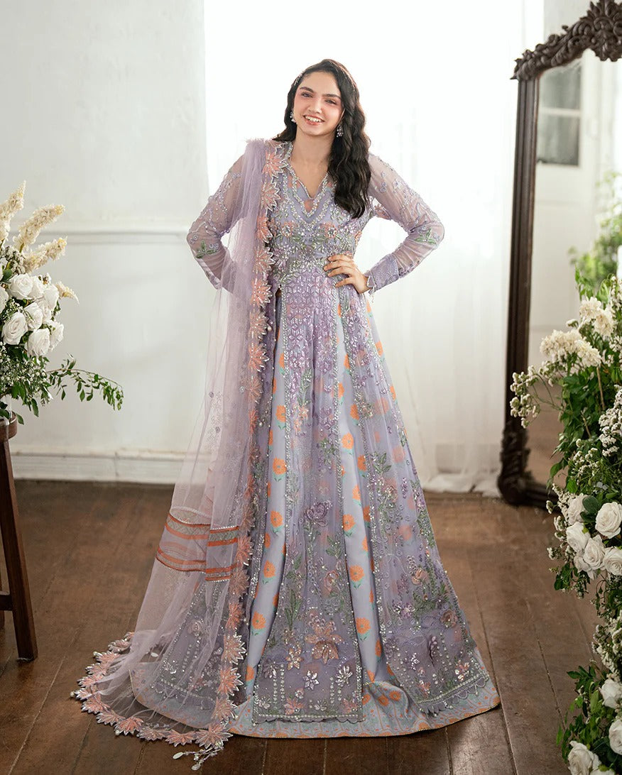 Shop this chiffon suit with hand embellishments, 3D florals, sequinned net dupatta & printed silk trouser. Includes tassels, lace & pearl detailing.