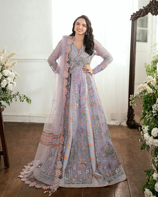 Shop this chiffon suit with hand embellishments, 3D florals, sequinned net dupatta & printed silk trouser. Includes tassels, lace & pearl detailing.