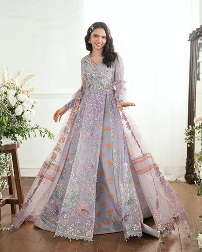 Shop this chiffon suit with hand embellishments, 3D florals, sequinned net dupatta & printed silk trouser. Includes tassels, lace & pearl detailing.
