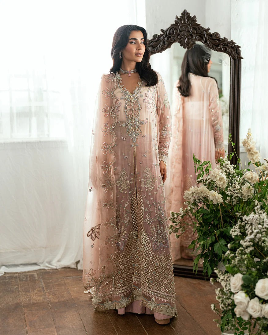 Luxurious chiffon suit with pearl & sequin work, foil printed silk trouser, and 3D floral organza dupatta. Includes tassels, zari & handcrafted finishes.