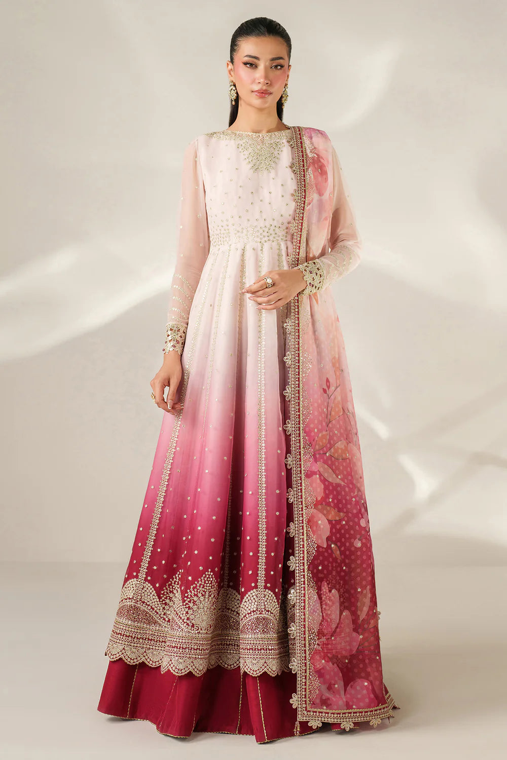 Expertly crafted embroidered chiffon ensemble with digitally printed yoke, panels, sleeves, detailed borders, elegant dupatta, and dyed raw silk bottom.