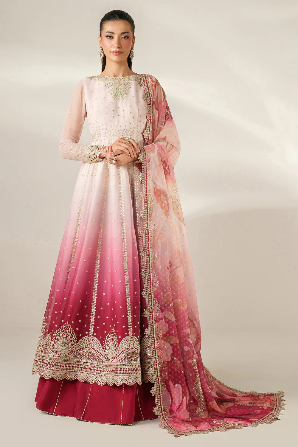 Expertly crafted embroidered chiffon ensemble with digitally printed yoke, panels, sleeves, detailed borders, elegant dupatta, and dyed raw silk bottom.