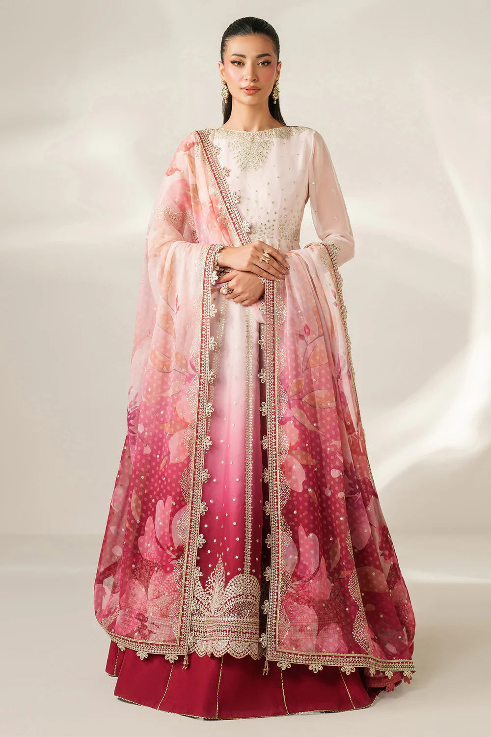Expertly crafted embroidered chiffon ensemble with digitally printed yoke, panels, sleeves, detailed borders, elegant dupatta, and dyed raw silk bottom.