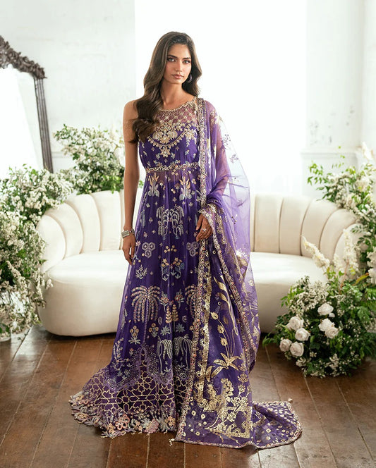 Graceful purple chiffon suit with hand embellishments, 3D daman lace, foil printed dupatta & raw silk trousers. Finished with tassels, pearls & tila lace.
