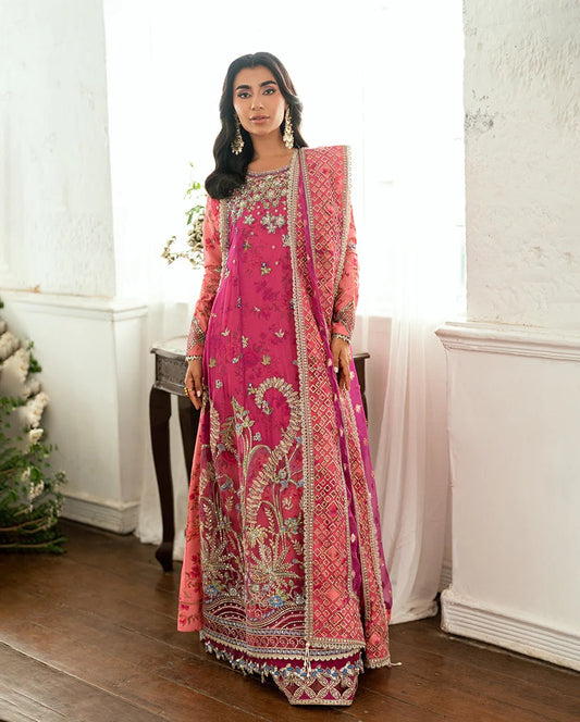 Shop this shocking pink chiffon suit with silk sleeves, lurex dupatta & raw silk trouser. Hand embellishments, sequins & tassels add a luxe festive finish!