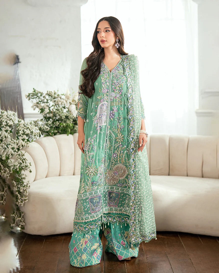Shop this sea green chiffon suit with hand embellishments, sequinned net dupatta, raw silk trousers, and handcrafted tassels. Perfect for festive occasions!