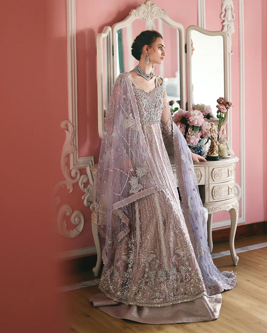 Luxury embroidered net shirt with sequins and pearls, paired with a dyed zari lehenga and embroidered net dupatta—perfect for weddings and festive occasions.
