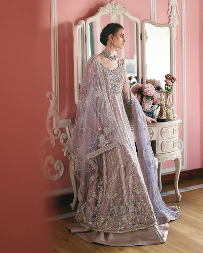 Luxury embroidered net shirt with sequins and pearls, paired with a dyed zari lehenga and embroidered net dupatta—perfect for weddings and festive occasions.