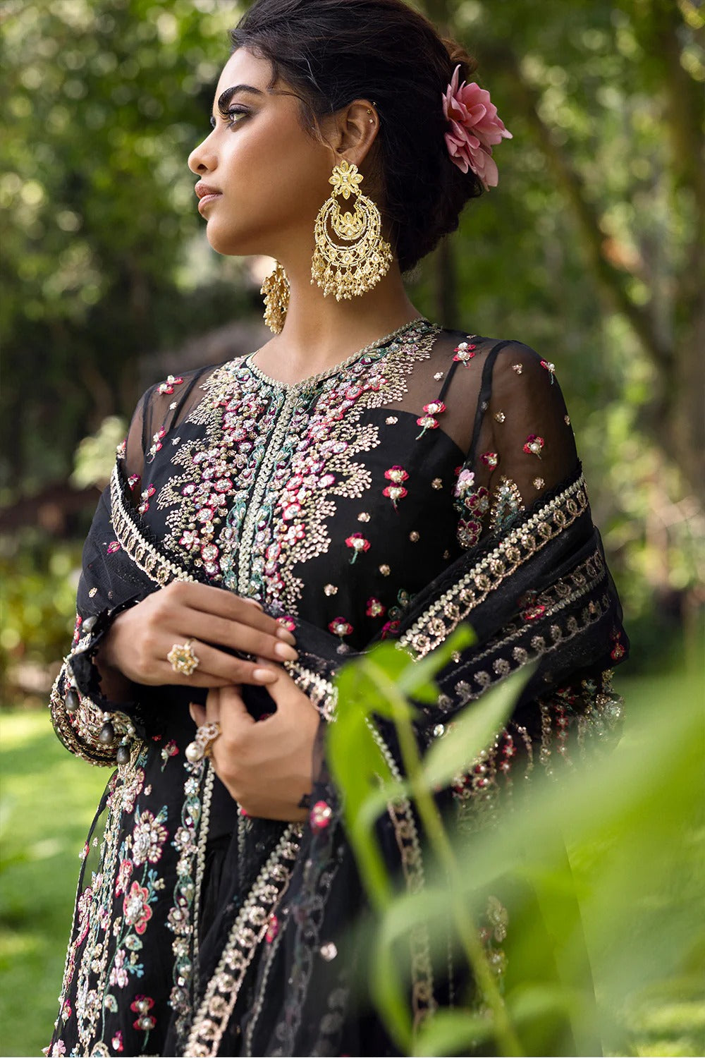 Elegant black 3-piece unstitched set in organza & net with hand and machine embroidery, including raw silk trouser and dupatta, perfect for weddings and festive events.