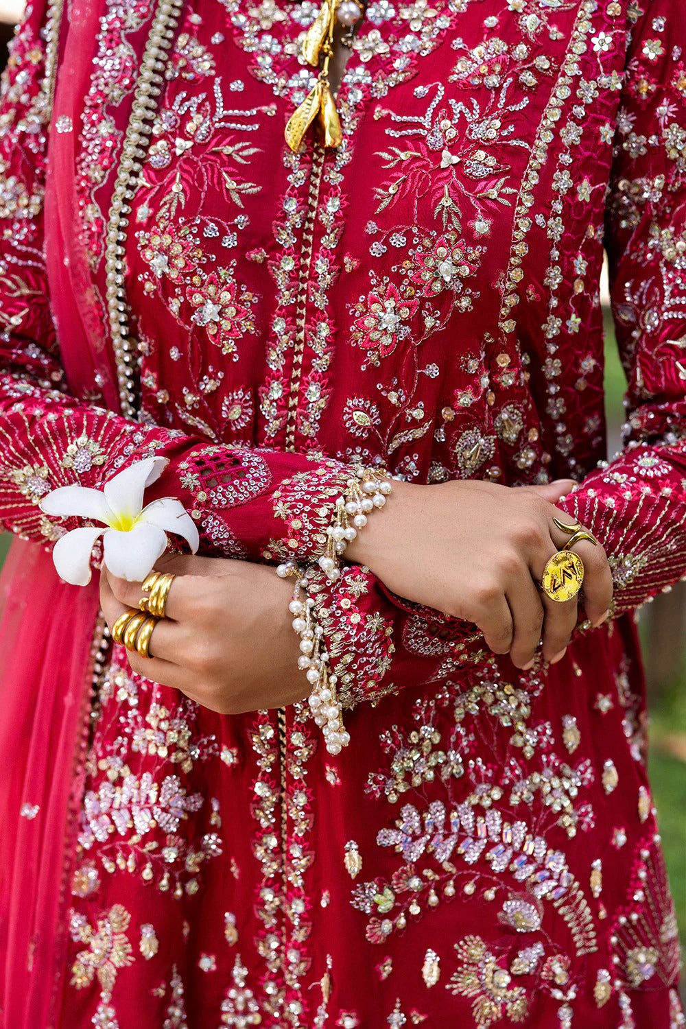 Stunning fuchsia pink 3-piece unstitched set in raw silk & net with hand and machine embroidery, including embroidered trouser and dupatta for festive occasions.