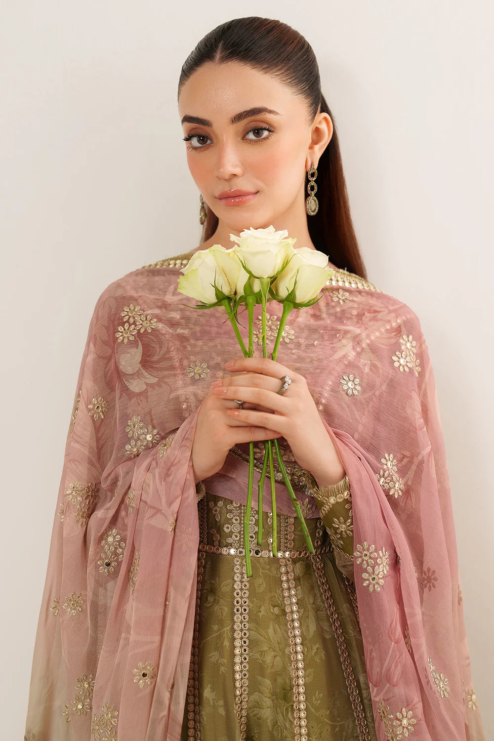 Graceful embroidered chiffon ensemble with printed sleeves, dupatta borders, and raw silk bottom. Elegant, lightweight design perfect for formal wear events.