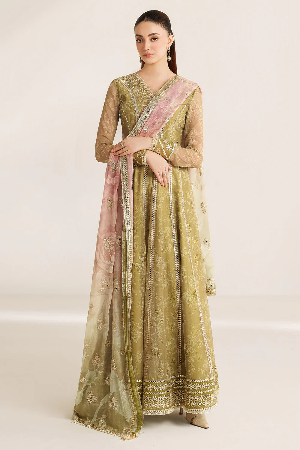 Graceful embroidered chiffon ensemble with printed sleeves, dupatta borders, and raw silk bottom. Elegant, lightweight design perfect for formal wear events.