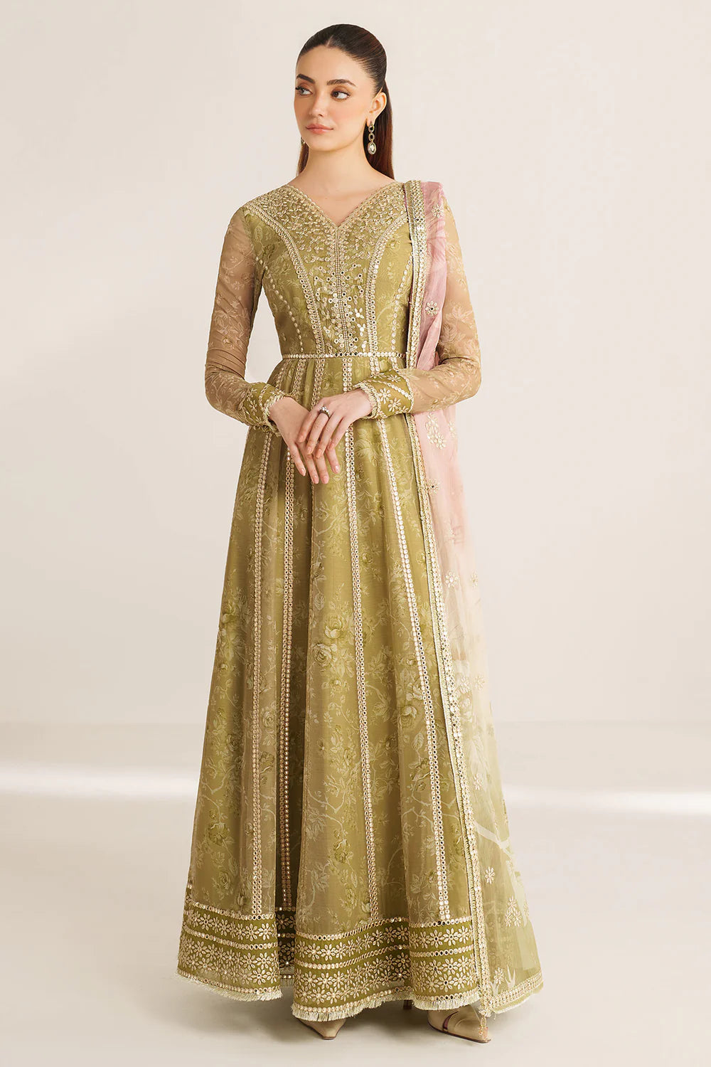 Graceful embroidered chiffon ensemble with printed sleeves, dupatta borders, and raw silk bottom. Elegant, lightweight design perfect for formal wear events.