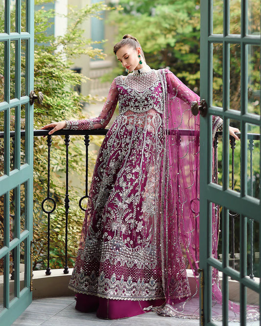 Hand-embellished embroidered net shirt with sequins and pearls, paired with a dyed raw silk lehenga and embroidered net dupatta—perfect for weddings and festive wear.
