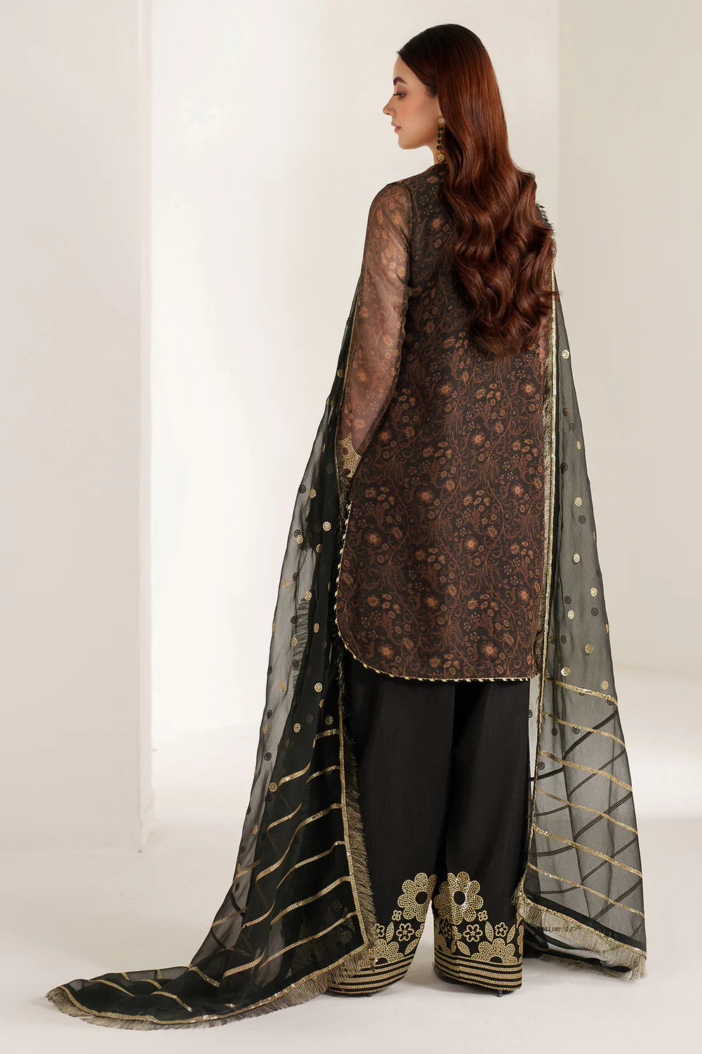 Graceful embroidered chiffon ensemble with printed front and sleeves, flowing back, rich raw silk bottom, and embroidered dupatta for timeless elegance.