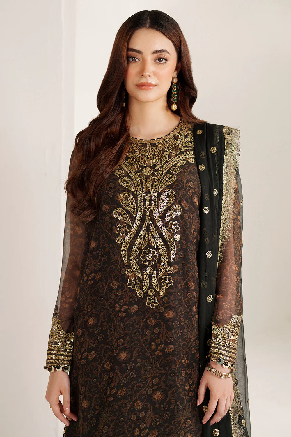 Graceful embroidered chiffon ensemble with printed front and sleeves, flowing back, rich raw silk bottom, and embroidered dupatta for timeless elegance.