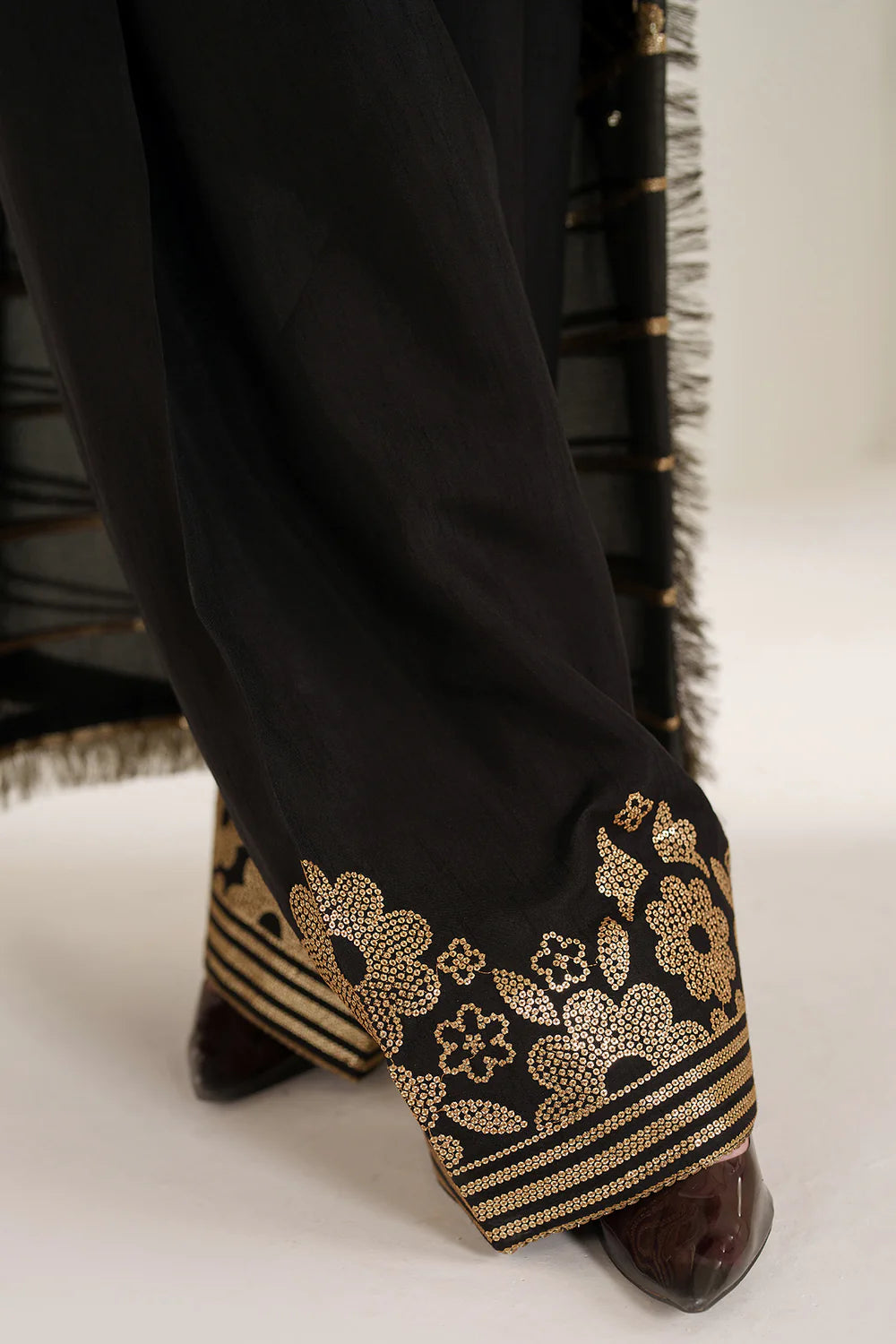 Graceful embroidered chiffon ensemble with printed front and sleeves, flowing back, rich raw silk bottom, and embroidered dupatta for timeless elegance.