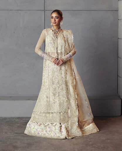 Edera exudes purity in white with hand-embellished organza panels, lilac-pink florals, and a scalloped embroidered dupatta — a vision of grace and artistry.