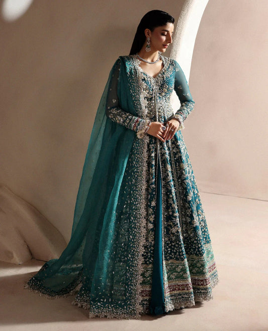 Grace meets glamour in this sage organza pishwas adorned with silver florals, sequins, and adda detailing — a timeless ode to feminine elegance and charm.