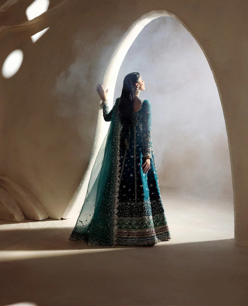 Grace meets glamour in this sage organza pishwas adorned with silver florals, sequins, and adda detailing — a timeless ode to feminine elegance and charm.