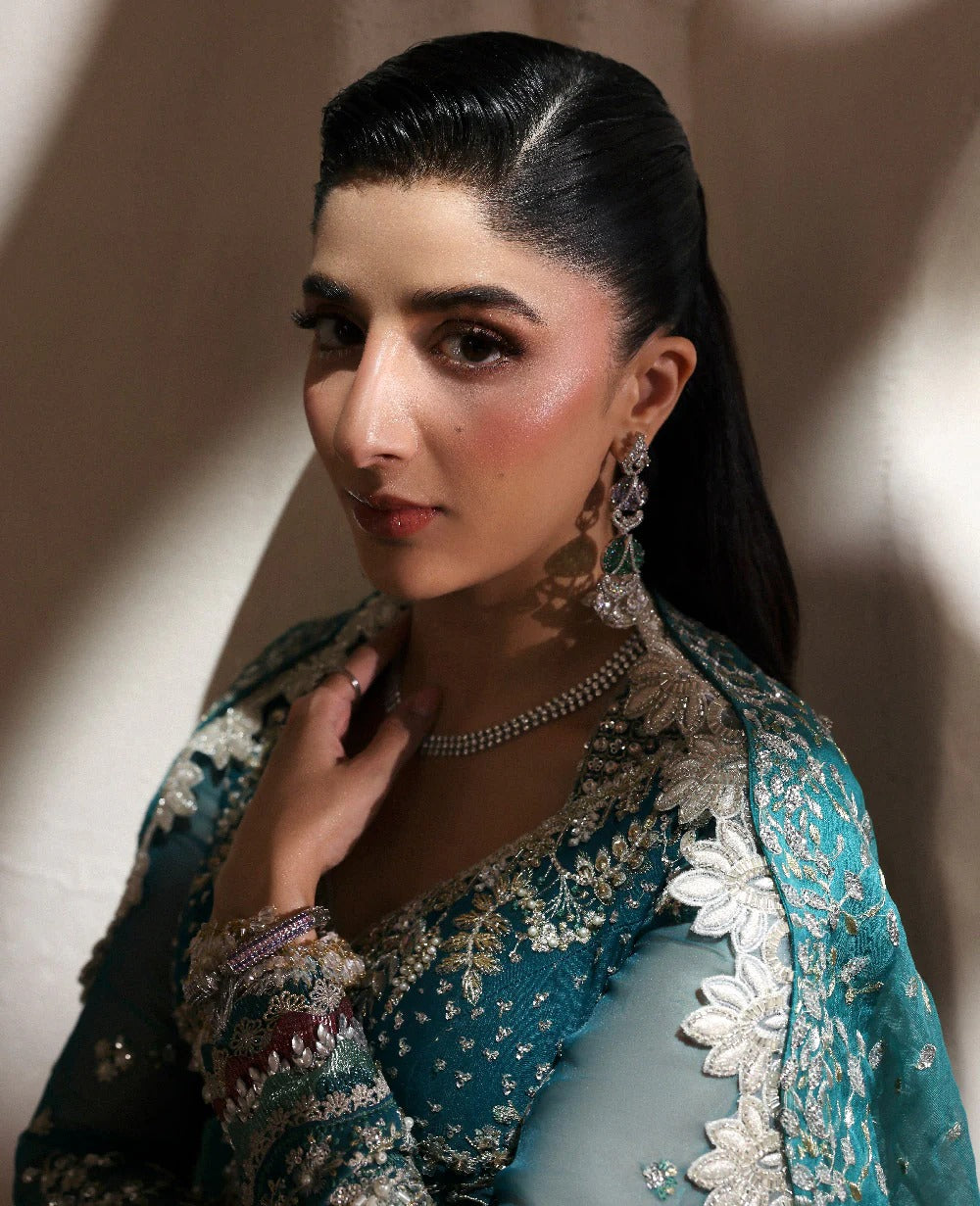 Grace meets glamour in this sage organza pishwas adorned with silver florals, sequins, and adda detailing — a timeless ode to feminine elegance and charm.