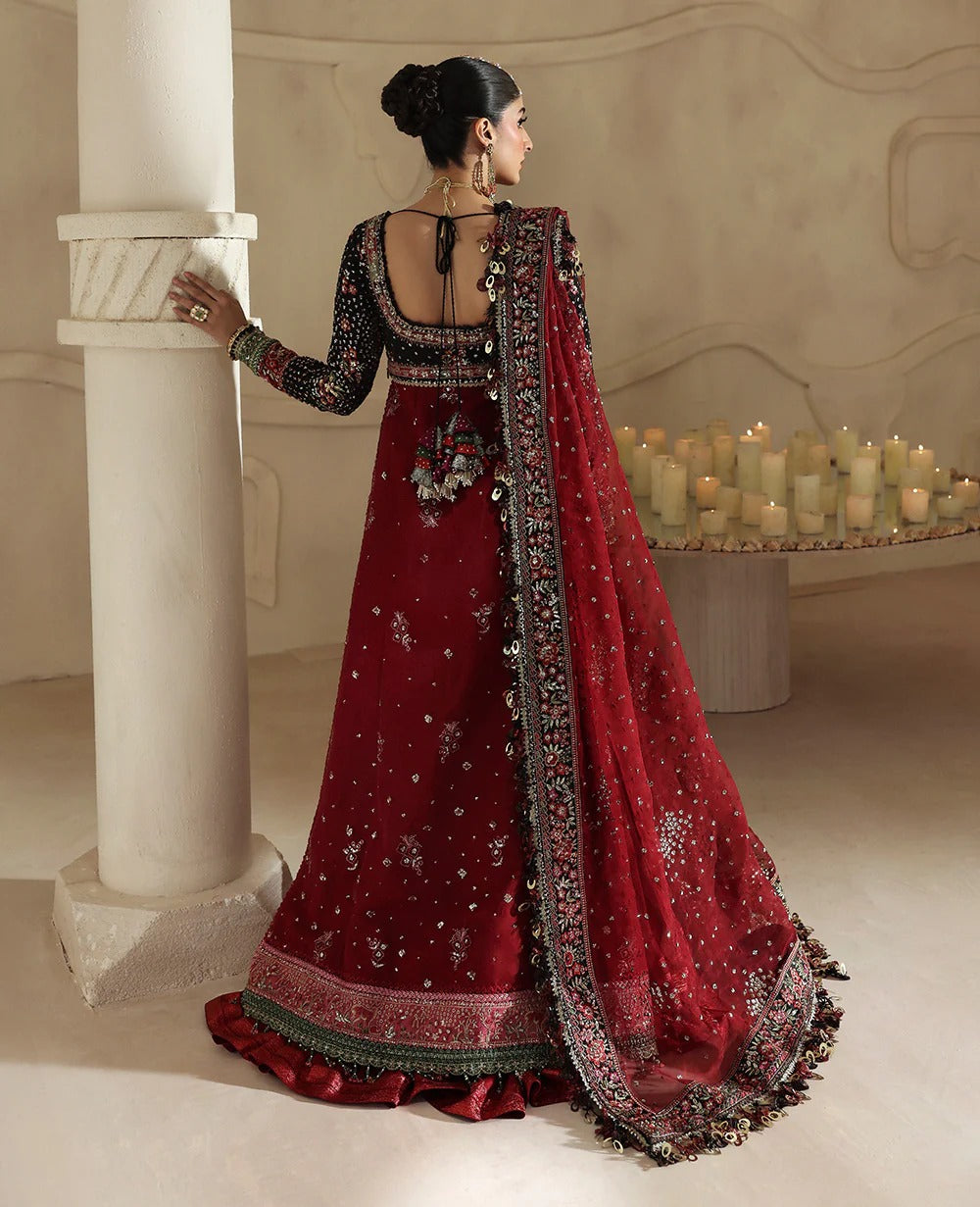Bold yet timeless, this black and red organza gown features hand embroidery, silver sequins, and a shimmering dupatta — a masterpiece of modern elegance.