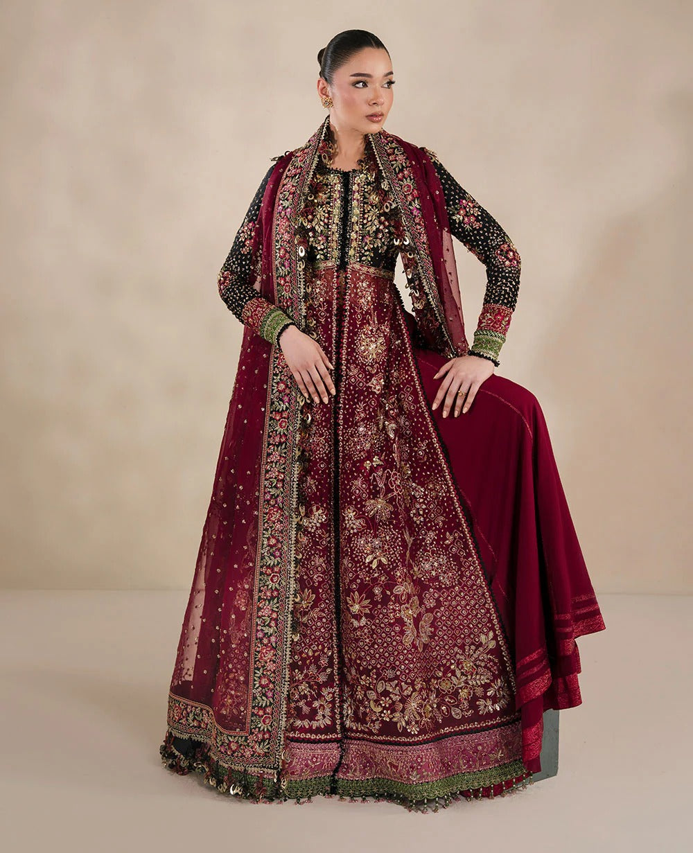 Bold yet timeless, this black and red organza gown features hand embroidery, silver sequins, and a shimmering dupatta — a masterpiece of modern elegance.