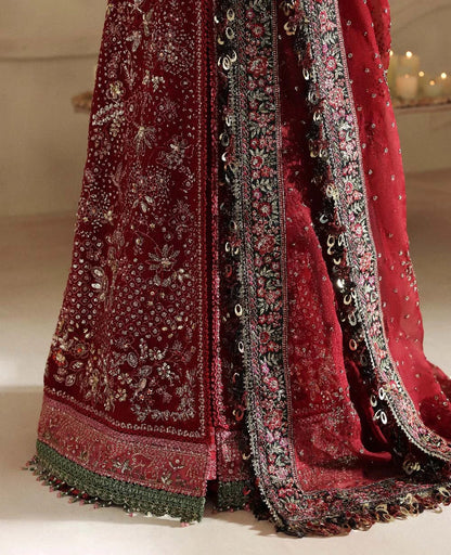 Bold yet timeless, this black and red organza gown features hand embroidery, silver sequins, and a shimmering dupatta — a masterpiece of modern elegance.