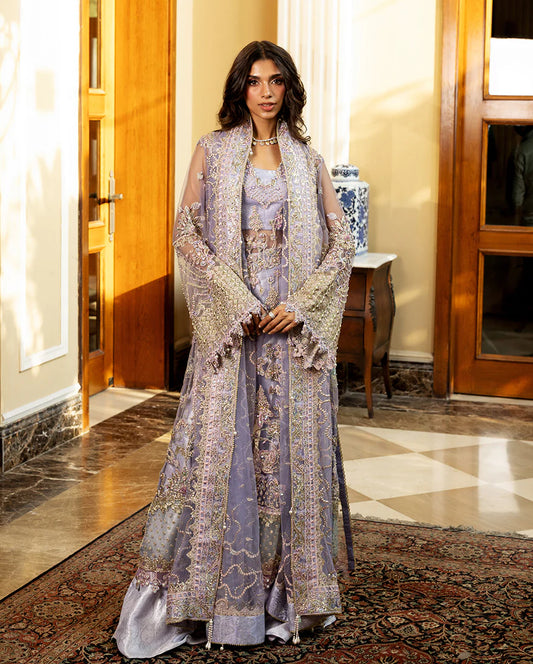 Luxury wedding formal featuring hand-embroidered sequined net shirt, organza daman borders, sequined dupatta, and dyed jamawar lehenga with pearl finishes.